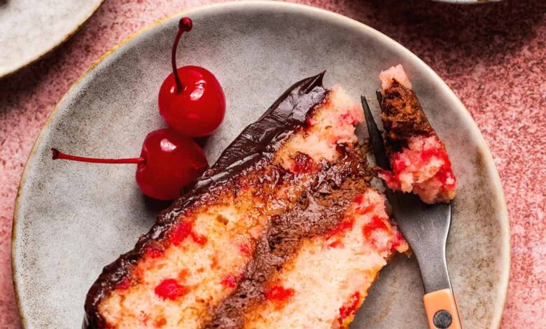 cherry chip cake with chocolate ganache frosting on plate with fork