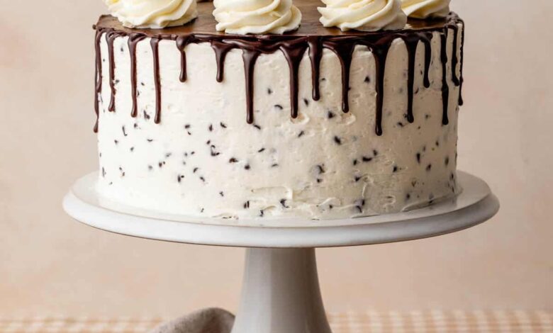 chocolate chip layer cake with buttercream and chocolate ganache drip.