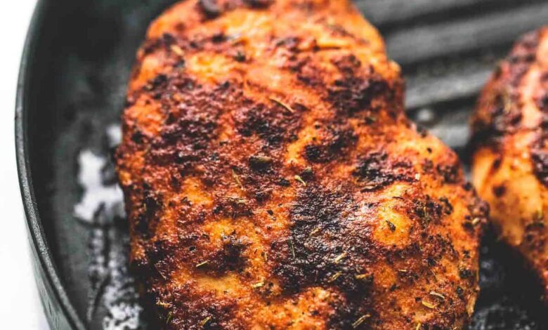 close up of chicken on a grill.