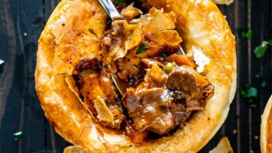 a fork inside a beef pot pie that was freshly baked.