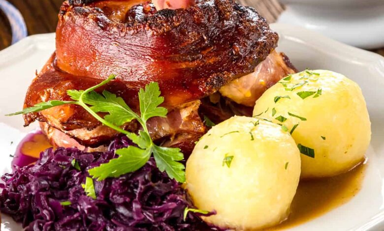 schweinshaxe recipe traditional german pork knuckles roasted grilled broiled crispy skin ham hocks bavarian oktoberfest authentic caraway seeds beer gravy eisbein